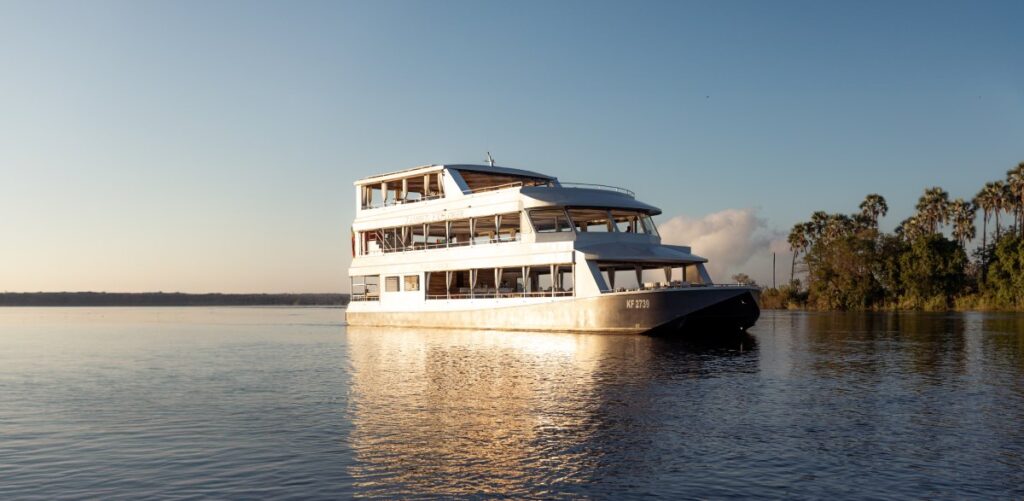 The Zambezi Explorer boat in sunset, part of Pure Africa's fleet.