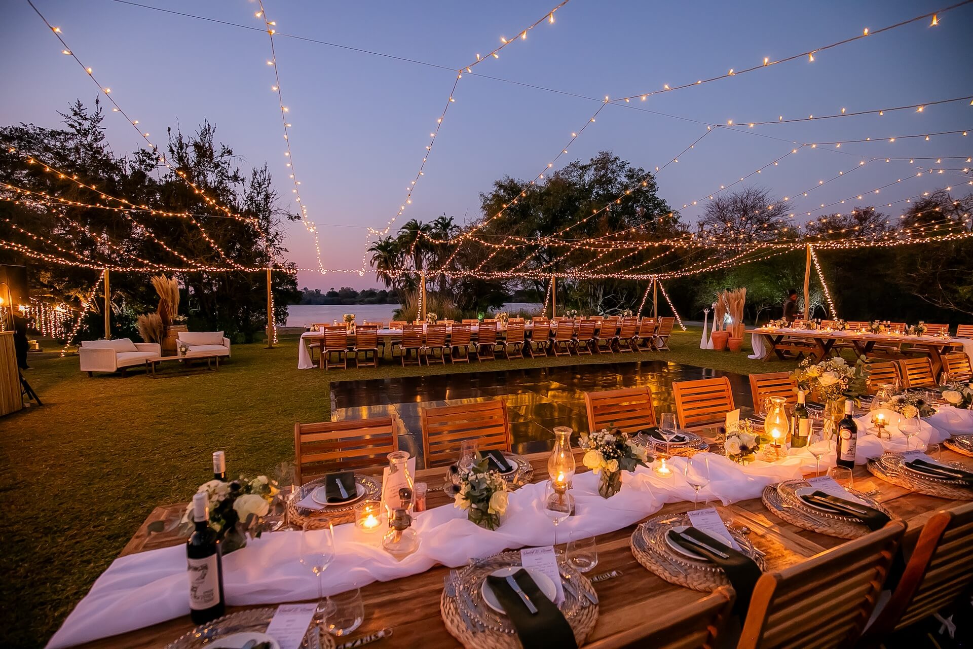 A beautifully set u-shaped table for Pure Africa celebrations and events in Victoria Falls.