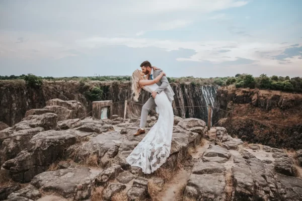 A couple enjoy a Pure Africa wedding at Victoria Falls in Zimbabwe.