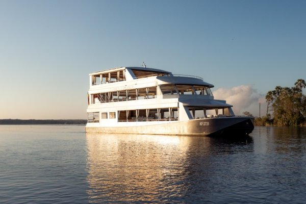 The Zambezi Explorer boat in sunset, part of Pure Africa's fleet.